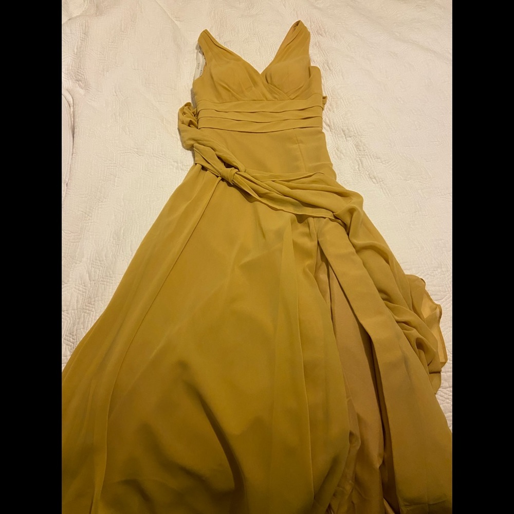 Azazie gold maxi dress, slit down side. Never worn, tags on sizing similar to 0